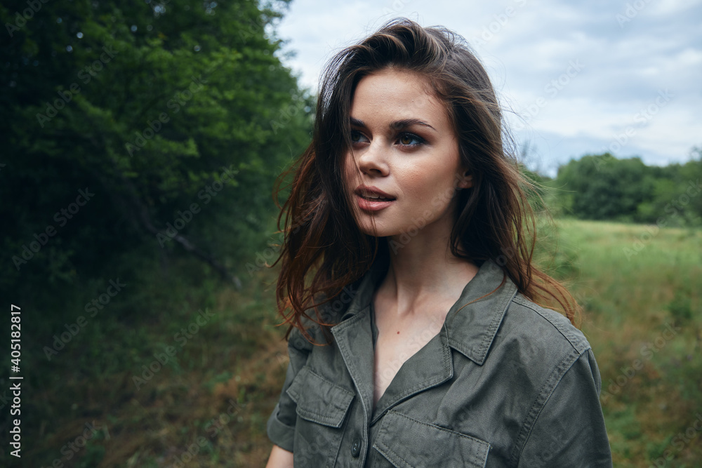 Woman in the meadow looking aside cropped view landscape fresh air Woman in the meadow looking aside cropped view landscape fresh air