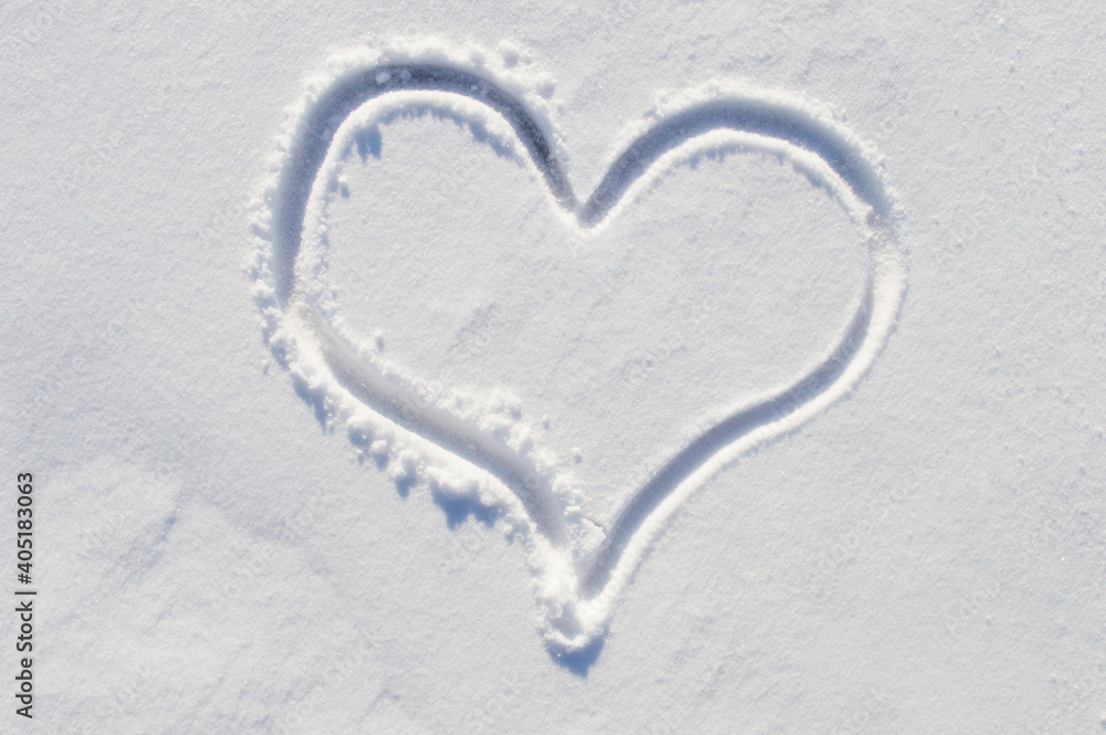 symbol of the heart, painted on the fresh white snow close up symbol of the heart, painted on the fresh white snow close up