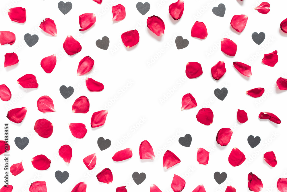 Rose petals and heart-shaped confetti are on a white background. Floral layout for valentine's day, birthday, wedding invitation. Flat lay. Top view. Copy space. Rose petals and heart-shaped confetti are on a white background. Floral layout for valentine's day, birthday, wedding invitation. Flat lay. Top view. Copy space.