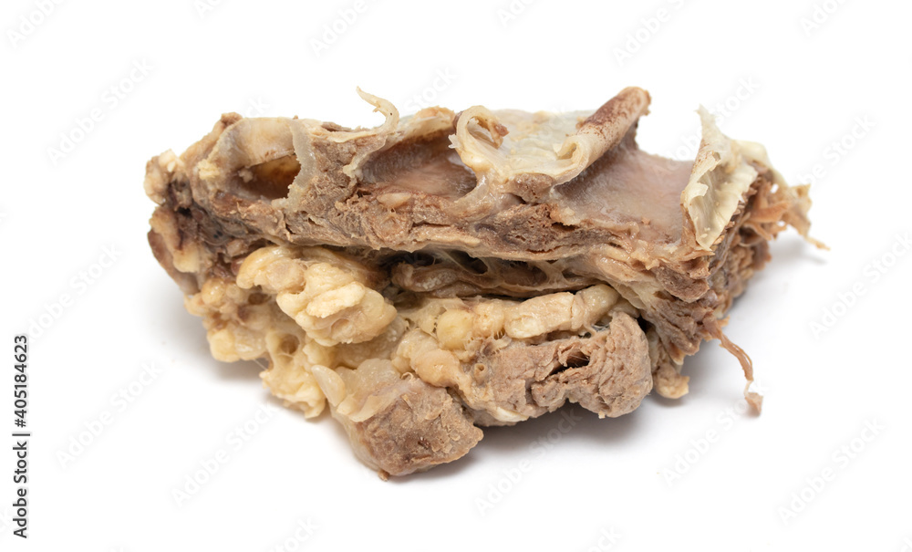 Piece of boiled beef with bone isolated on white background. Piece of boiled beef with bone isolated on white background.