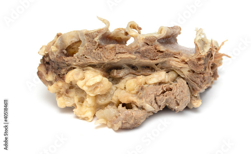 Piece of boiled beef with bone isolated on white background.