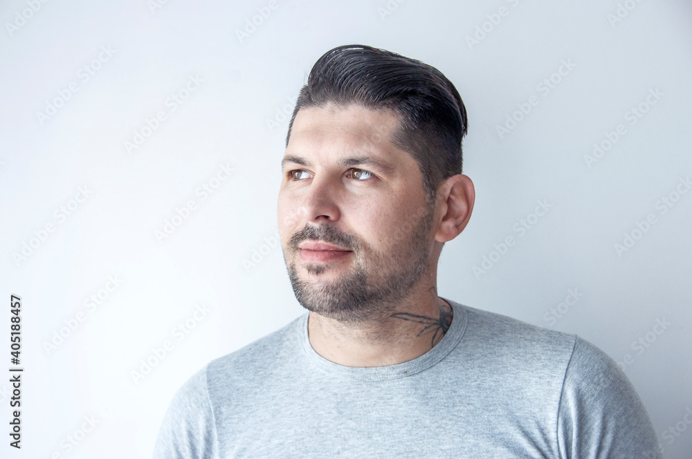 Young handsome man with happy face smiling with crossed arms looking at the camera. Positive person. Young handsome man with happy face smiling with crossed arms looking at the camera. Positive person.