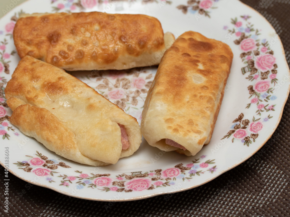 Sausage in dough fried on a breakfast plate. Sausage in dough fried on a breakfast plate.