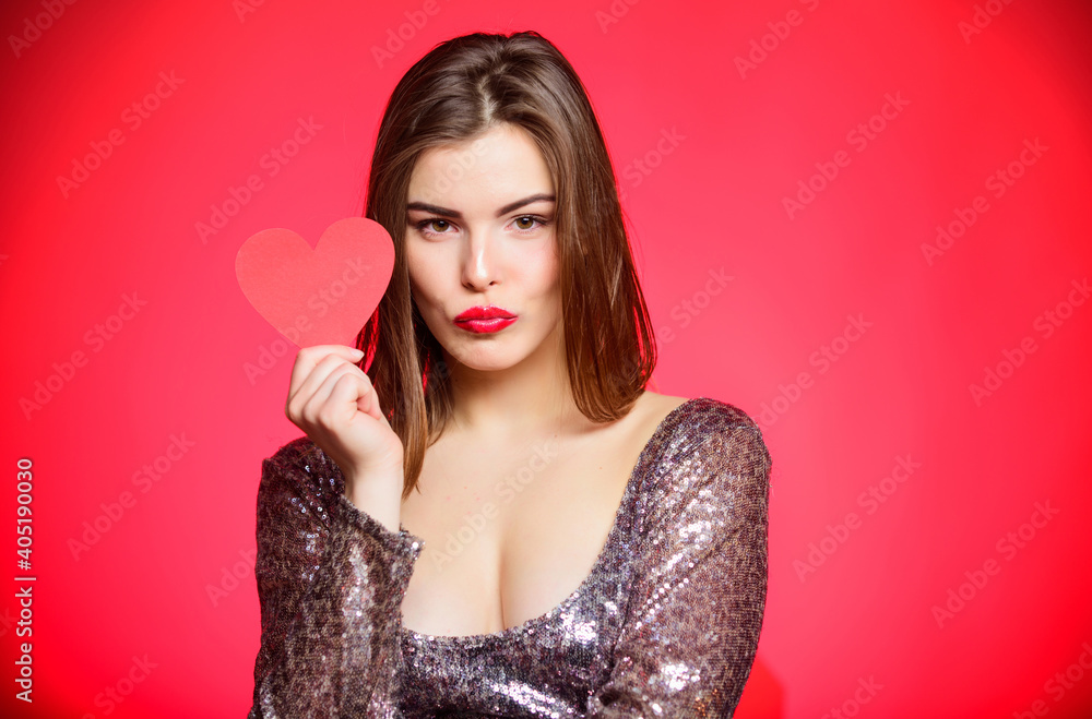 Keeping love in her heart. Romantic greeting. Be my valentine. Love and romance. Valentines day sales. Valentines day party. I love you. Sexy woman in glamour dress. Sensual girl with heart Keeping love in her heart. Romantic greeting. Be my valentine. Love and romance. Valentines day sales. Valentines day party. I love you. Sexy woman in glamour dress. Sensual girl with heart