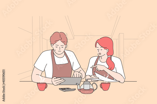 Bankrupt and calculating restaurant expenses concept. Worried woman and man owners sitting in empty restaurant and calculating finances during coronavirus pandemic crisis times 