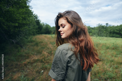 Woman in the meadow Eyes closed looking towards the fresh air of lifestyle freedom 