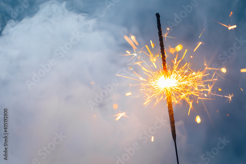 fire sparkler in dense smoke  abstract Christmas firework background