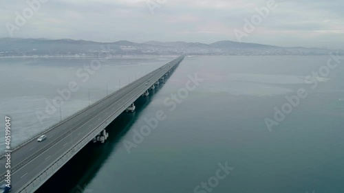 Wallpaper Mural Aerial drone view of low-water bridge across the bay with moving car. Active movement of transport cars vehicles in different directions. Torontodigital.ca