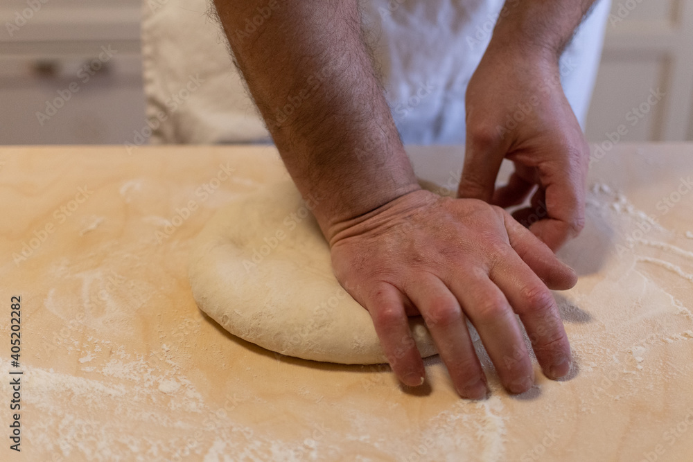 Preparing bread for fried gnocco, one of the best food of the Emilian cuisine