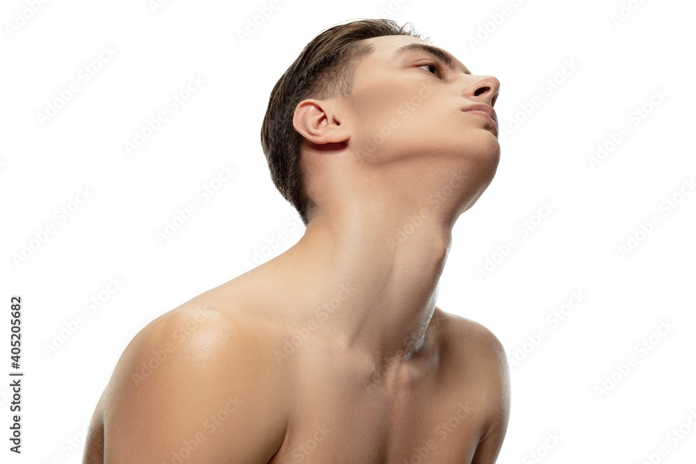 Muscular. Portrait of young man isolated on white studio background. Caucasian attractive male model. Concept of fashion and beauty, self-care, body and skin care. Handsome boy with well-kept skin. Muscular. Portrait of young man isolated on white studio background. Caucasian attractive male model. Concept of fashion and beauty, self-care, body and skin care. Handsome boy with well-kept skin.