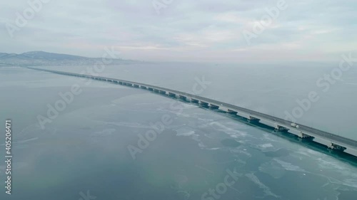 Wallpaper Mural Aerial drone view of low-water bridge across the bay with moving car. Active movement of transport cars vehicles in different directions. Torontodigital.ca