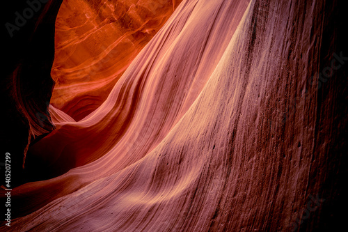 Red sandstone textures of Antelope Canyon, the most-visited and most photographed slot canyon in the American Southwest located on Navajo land near Page, Arizona, USA. 