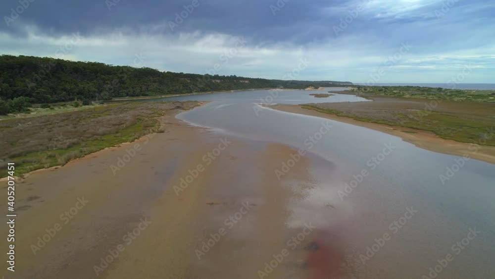 Backward flight over Snowy River estuary in Marlo, Australia Backward flight over Snowy River estuary in Marlo, Australia