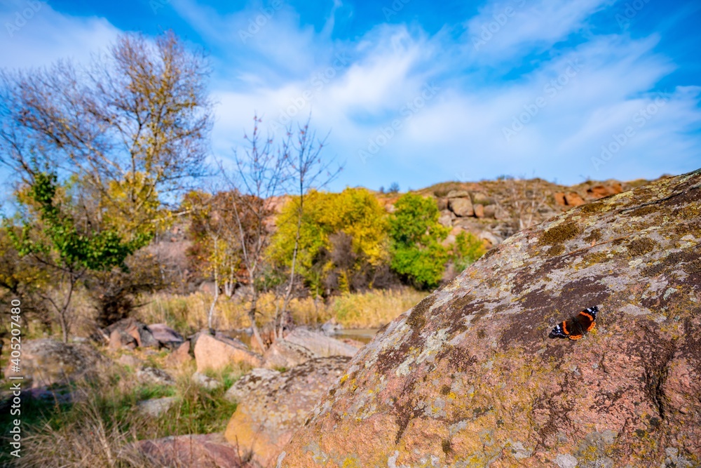 Huge deposits of stone minerals in a clearing bathed in warm sun in picturesque Ukraine Huge deposits of stone minerals in a clearing bathed in warm sun in picturesque Ukraine