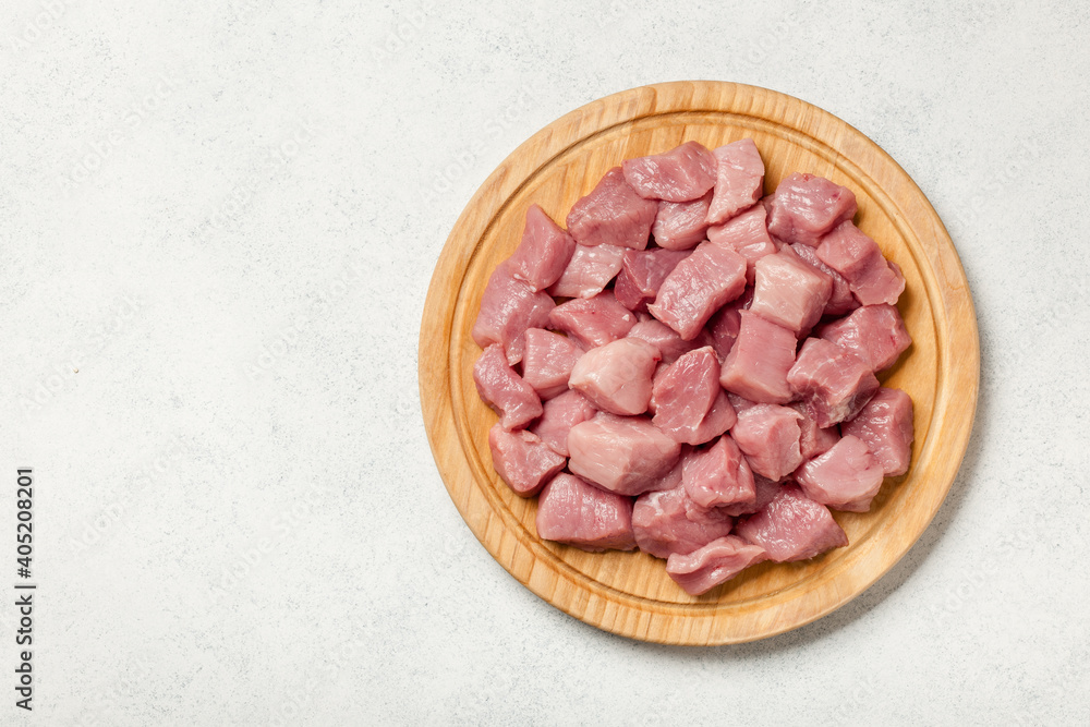 Fresh pork meat on cutting board for cooking Fresh pork meat on cutting board for cooking
