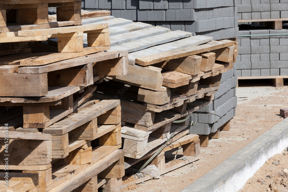 empty wooden pallets and new construction tiles empty wooden pallets and new construction tiles