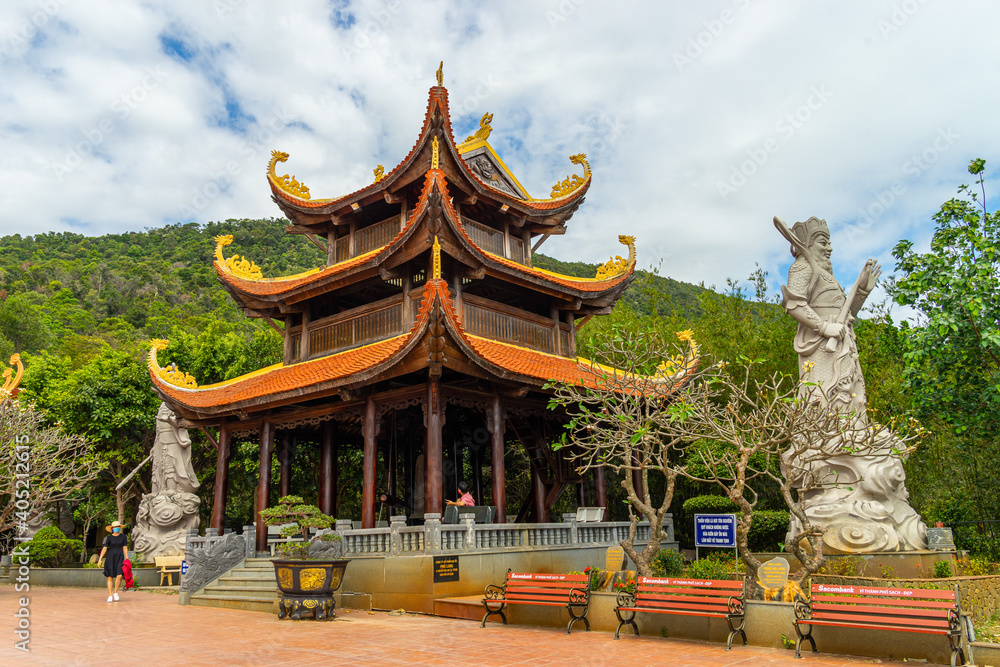 Naklejka premium Wide angle view of Ho Quoc pagoda (Vietnamese name is Truc Lam Thien Vien) with big statue of guanyin bodhisattva on mount, Phu Quoc island, Vietnam