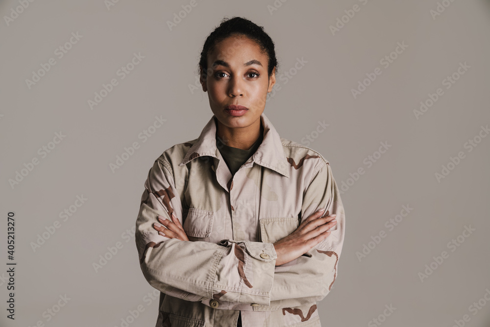 Fototapeta premium Confident african american soldier woman posing with arms crossed