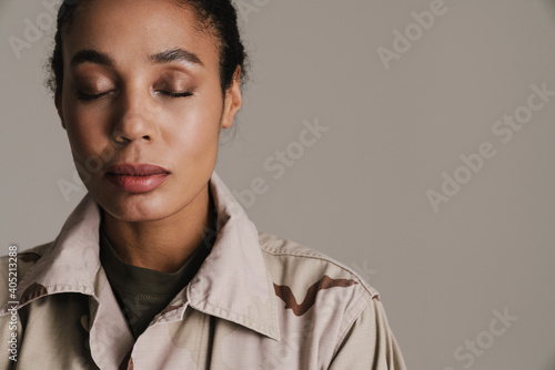 Calm african american soldier woman posing with eyes closed