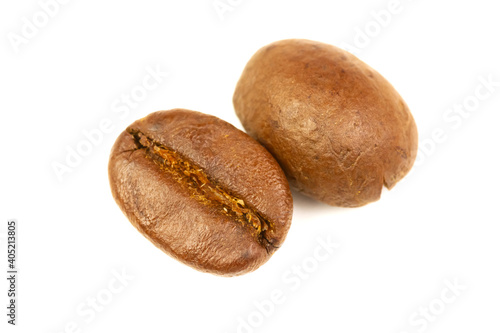 Close-up two roasted coffee bean isolated on white background.