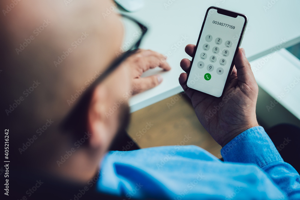 Crop unrecognizable man using modern smartphone Crop unrecognizable man using modern smartphone