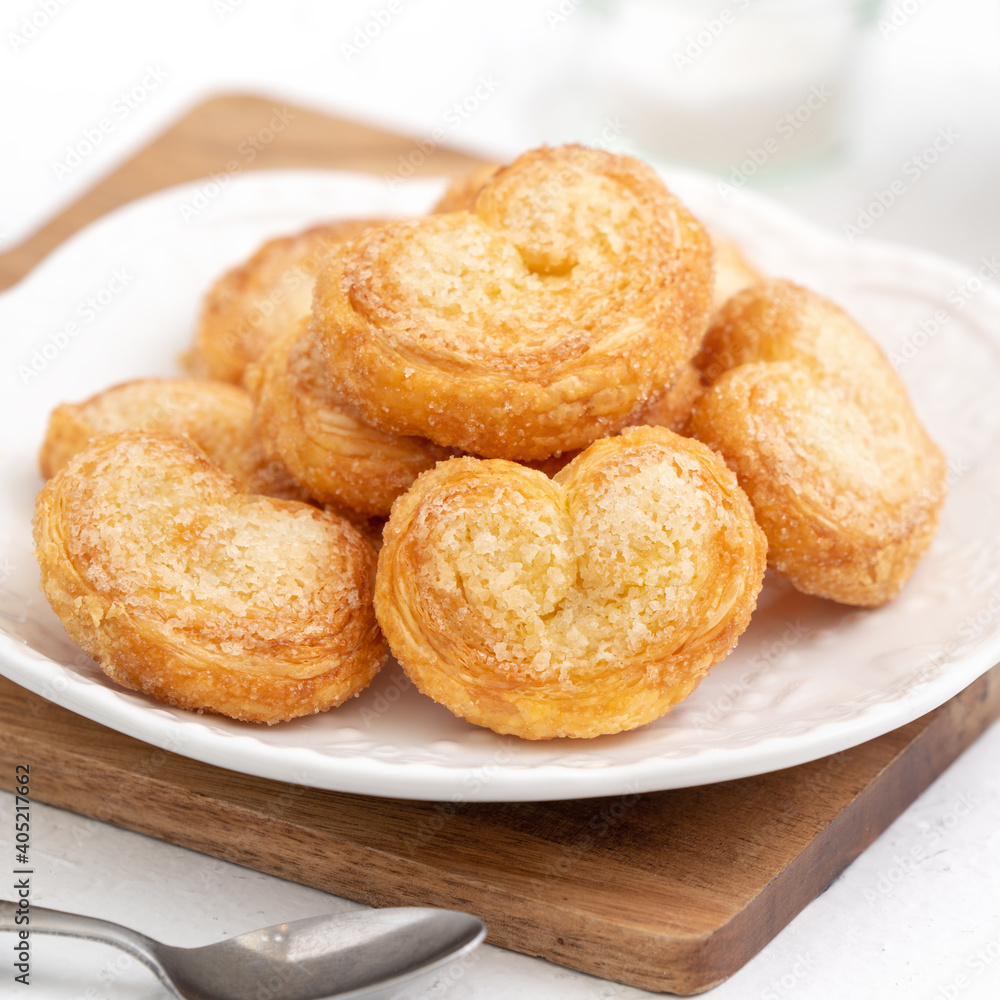 Delicious Palmier butterfly pastry in heart shape for Valentine's day dessert. Delicious Palmier butterfly pastry in heart shape for Valentine's day dessert.