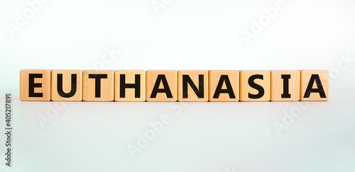 Euthanasia symbol. Wooden cubes with the word 'Euthanasia'. Medical and euthanasia concept. Beautiful white background, copy space.
