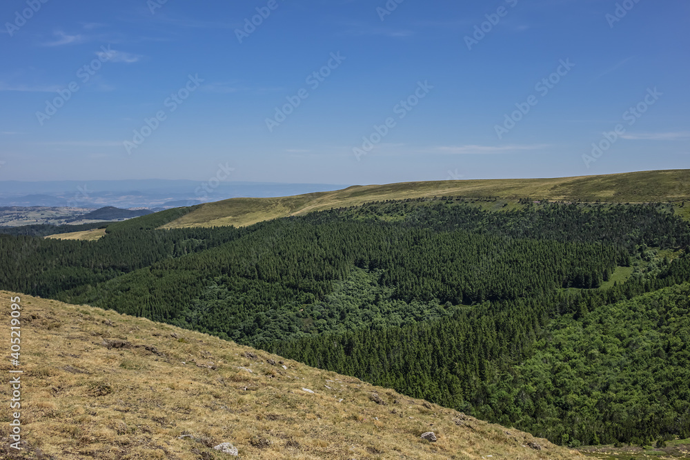 Fototapeta premium Beautiful highland landscapes in Volcans d'Auvergne regional Natural Park. Massif Central, Auvergne-Rhone-Alpes administrative region, France.