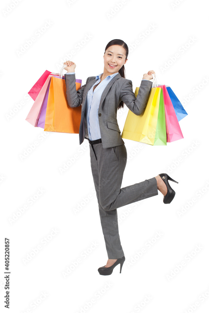 A happy Young woman holding shopping bags A happy Young woman holding shopping bags