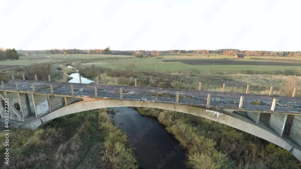 Abandoned bridge to nowhere in field. Unfinished bridge. Aerial shot from drone. Abandoned bridge to nowhere in field. Unfinished bridge. Aerial shot from drone.