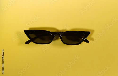 Funny sunglasses on yellow background. Gangster, Black thug life meme glasses. 