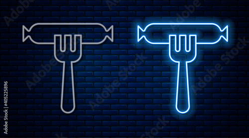 Glowing neon line Sausage on the fork icon isolated on brick wall background. Grilled sausage and aroma sign. Vector.