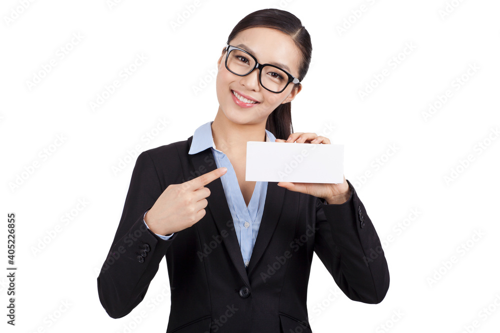 Smiling businesswoman holding blank card in an office
