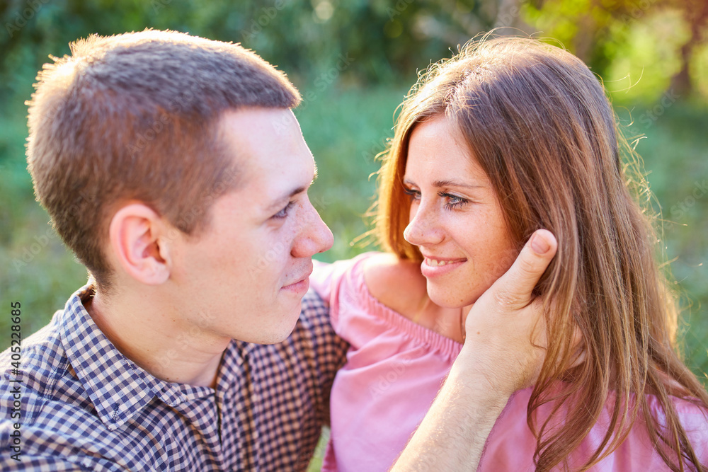 Young couple in love outdoor.Stunning sensual outdoor portrait of young stylish fashion couple posing in summer in field. Young couple in love outdoor.Stunning sensual outdoor portrait of young stylish fashion couple posing in summer in field.