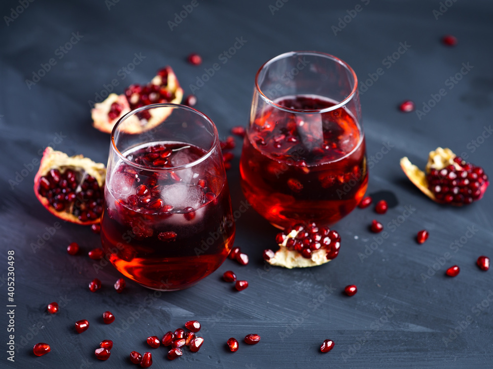 Alcoholic red cocktail with champagne and pomegranate juice, mimosa with pomegranate and ice Alcoholic red cocktail with champagne and pomegranate juice, mimosa with pomegranate and ice
