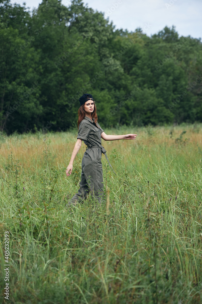 Woman green jumpsuit travel fresh air landscape Woman green jumpsuit travel fresh air landscape