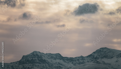 View of the highest peaks of Sierra Nevada (Granada, Spain) on a cloudy winter morning at sunrise