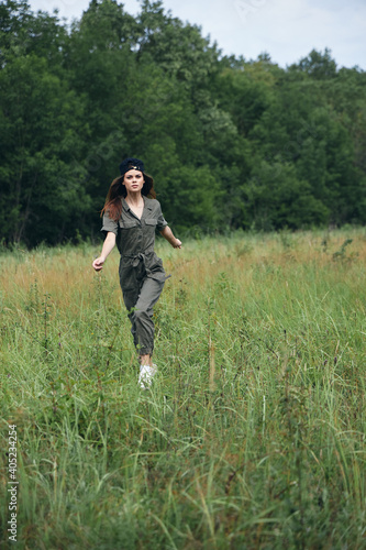 woman outdoors High grass runs across the field for summer  © SHOTPRIME STUDIO