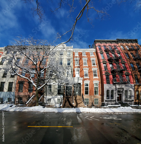 Photography Snowy winter scene with colorful apartment buildings on 10th Street in the East