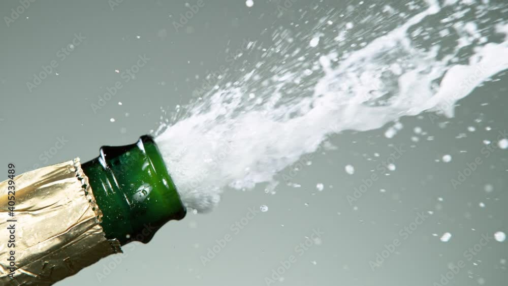Super slow motion of Champagne explosion with flying cork closure, opening champagne bottle closeup. Super slow motion of Champagne explosion with flying cork closure, opening champagne bottle closeup.