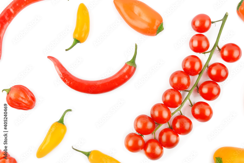 Cherry tomatoes, cayenne and chili pepper isolated on a white background. Cherry tomatoes, cayenne and chili pepper isolated on a white background.