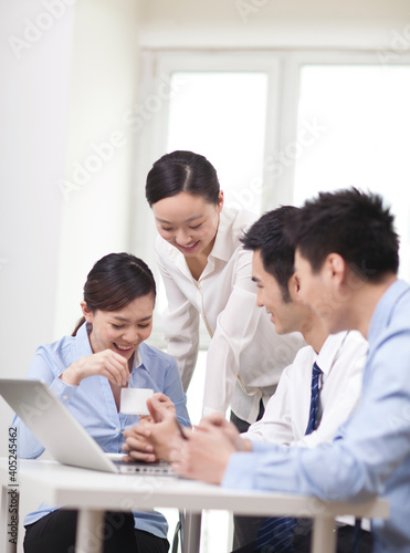 Group of business people discussing in office