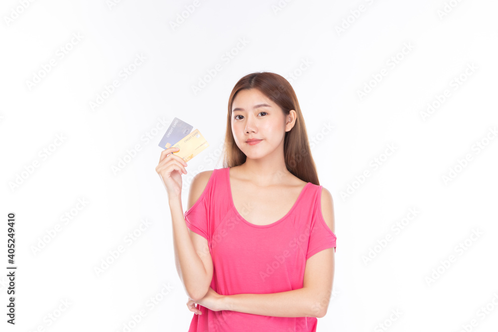 Portrait asian young girl happy and smile shopping online concept. Attractive beautiful asian young woman showing credit card for shopping online, payment on white background with copy space. Portrait asian young girl happy and smile shopping online concept. Attractive beautiful asian young woman showing credit card for shopping online, payment on white background with copy space.