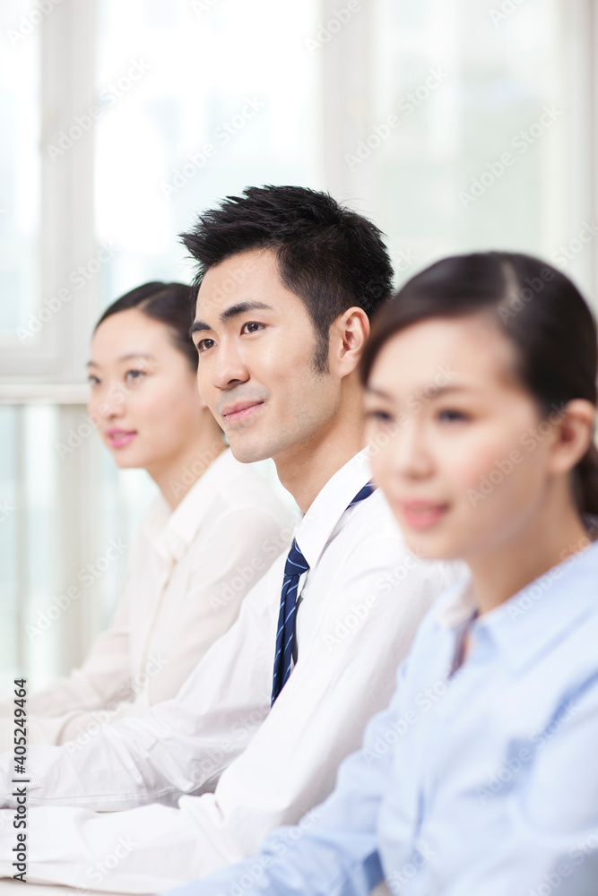 Group of business people sitting at conference table Group of business people sitting at conference table