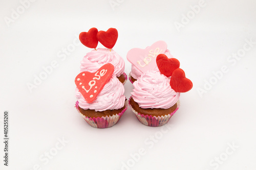 Valentine's Day. Cupcakes with hearts on a white background for Valentine's Day.