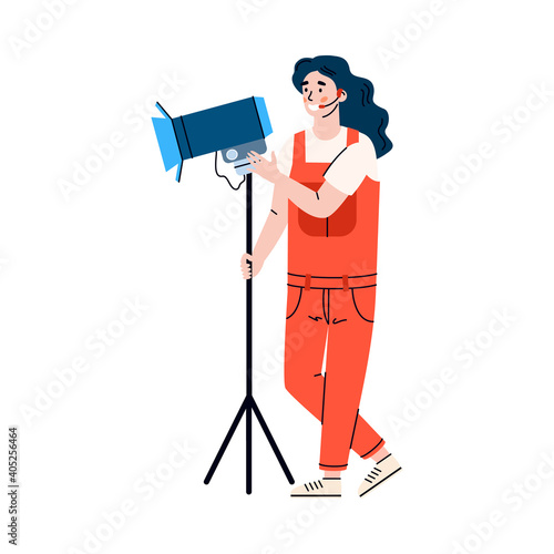 Woman illuminator on shooting site or lighting operator with spotlight, cartoon vector illustration isolated on white background. Female worker of filmmaking industry.