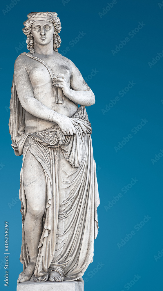 Ancient statue of beautiful topless Roman woman of Renaissance Era at gradient blue background and copy space for text, details, closeup