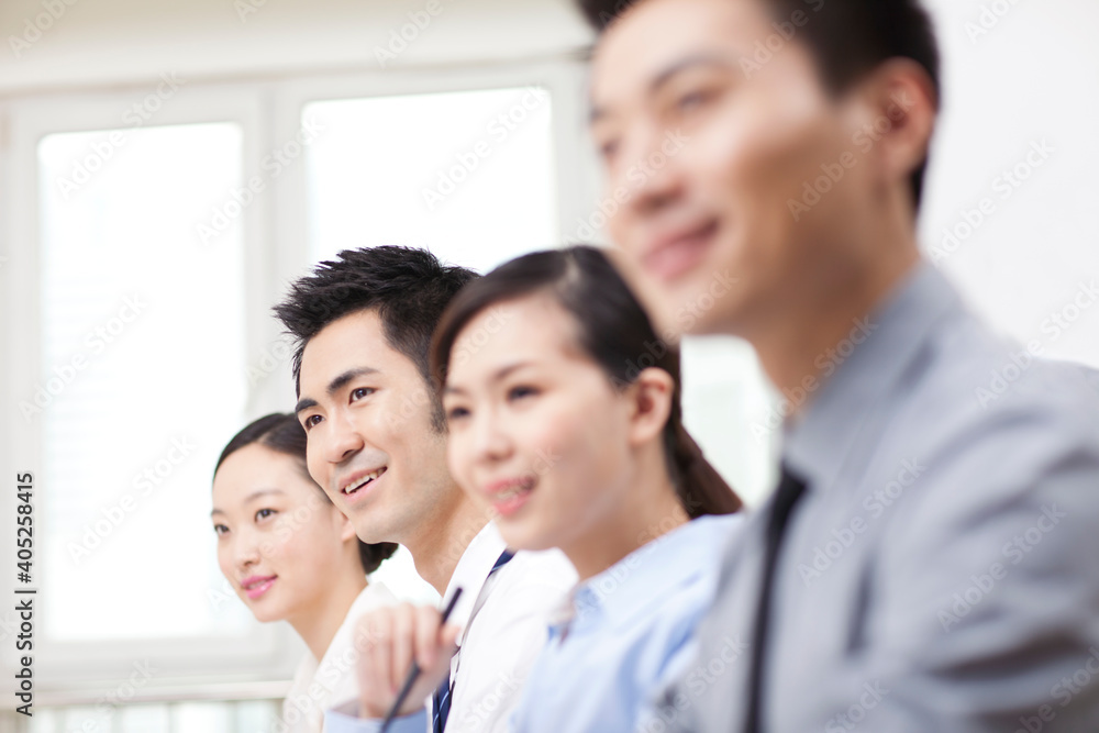 Group of business people sitting at conference table Group of business people sitting at conference table