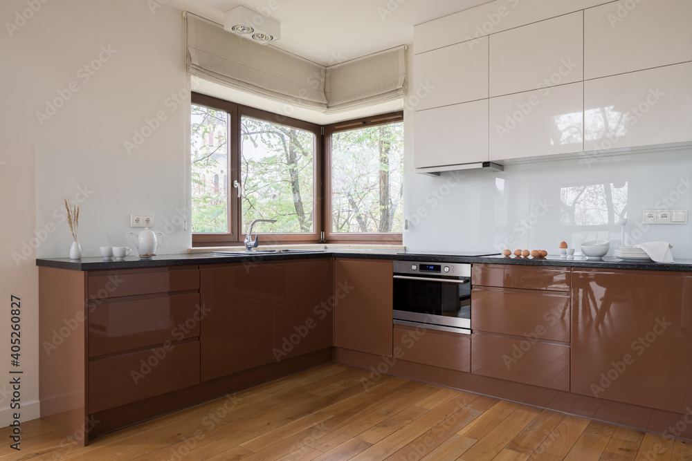 Kitchen with brown and white furniture Kitchen with brown and white furniture
