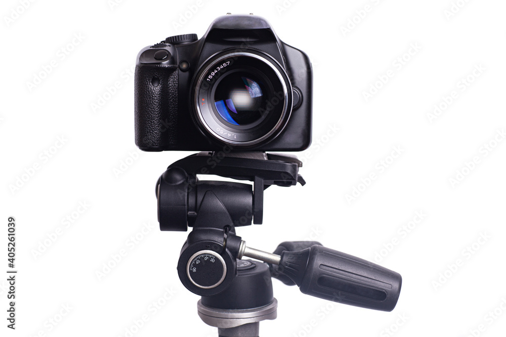 Digital photo camera on black tripod isolated on white background